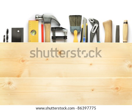 Carpentry background. Tools underneath the wood plank.