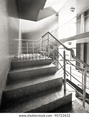 Empty concrete building stairway composition.