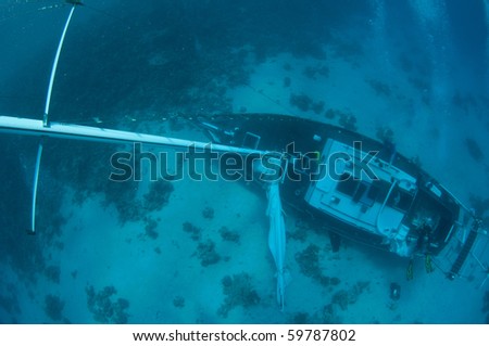 stock-photo-underwater-sunken-sail-boat-