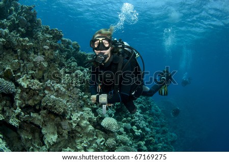 female scuba diver enjoys a great scuba dive in red sea