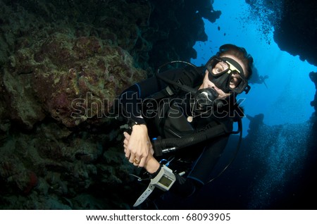 female scuba diver in a cave