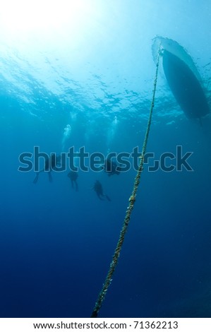 Dive boat and scuba divers