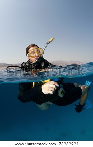 female scuba diver on surface
