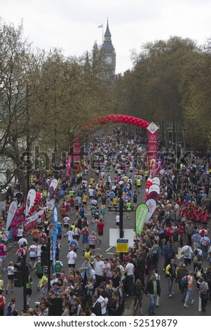 LONDON - APRIL 25: Runners take part in the Virgin London Marathon on Embankment at the 25 mile marker near Big Ben on April 25, 2010 in Westminster, England