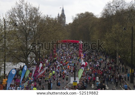 LONDON - APRIL 25: Runners take part in the Virgin London Marathon on Embankment at the 25 mile marker near Big Ben on April 25, 2010 in Westminster, England