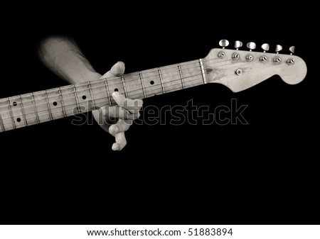 playing old electrical guitar in black and white