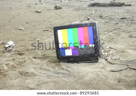 old tv playing color bars in desert .with path on screen