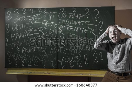 man at the blackboard writes various professions