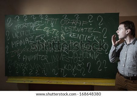 man at the blackboard writes various professions