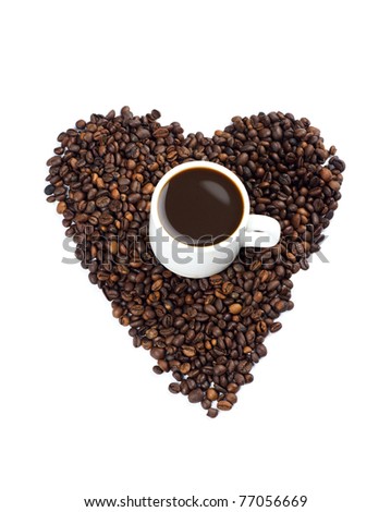 Coffee beans in the shape of a heart with a cup of coffee isolated on white, I love coffee idea.