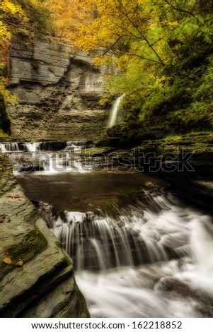 Eagle Cliff falls at Havana Glen in New York during fall. A beautiful short gorge in the Finger Lakes region. This photo has been given a photoshop effect to make it look like a painting.