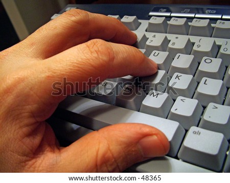 Typing on a keyboard.