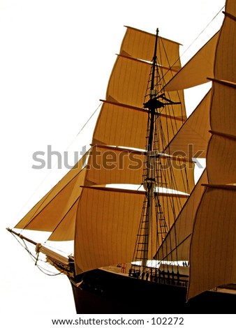 Closeup of a wooden model ship. Isolated on a white background.