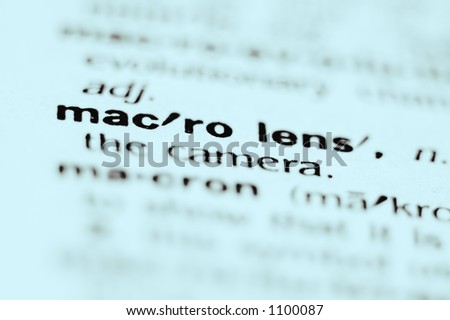Extreme macro or close up of the words MACRO LENS. Very shallow depth of field is intentional and shows only the words macro lens in focus.