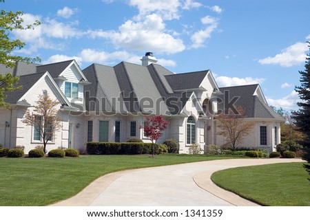 Beautifully, large and expensive  new home. This house features lots of roof peaks and a circular driveway. Just one of many new home or house photos in my gallery.