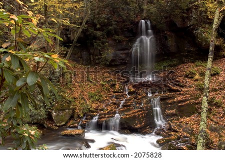 This is what is called a wet weather waterfall. It only appears during very rainy weather. Nice autumn  colors with lots of colorful leaves adds to the scene.