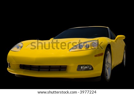 stock photo A Yellow Corvette sports car isolated on a black background