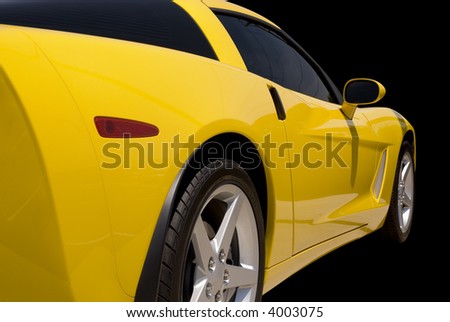 Yellow  sports car isolated on a black background.