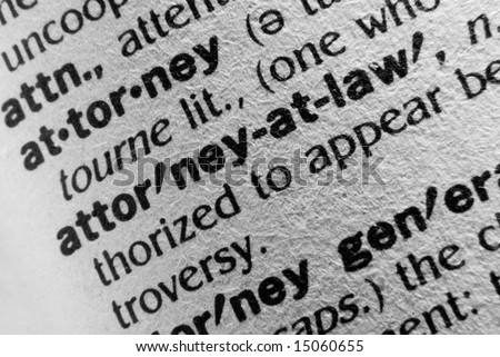 A macro photo of the definition of the word Attorney and Attorney at Law. Lots of texture in the paper.