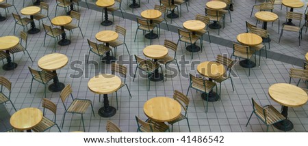 Empty table and chairs in a food court waiting for hungry customers.