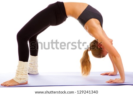 woman practices yoga on a white background, isolated.