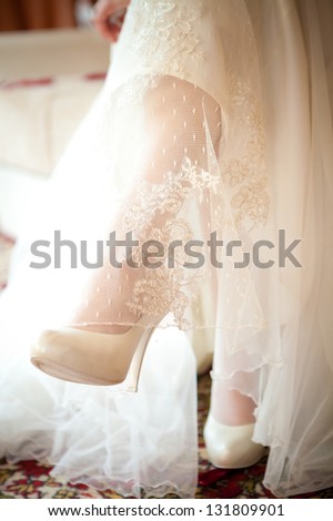 feet of the bride in shoes, wedding details
