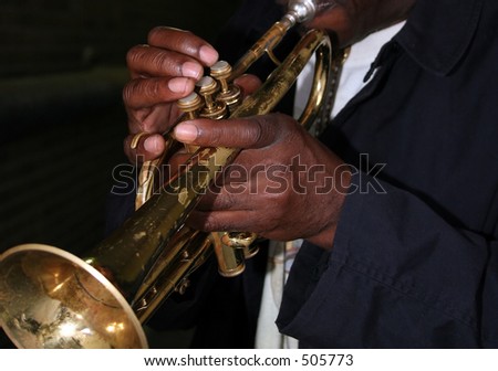 Hands of an African American man playing the trumpet
