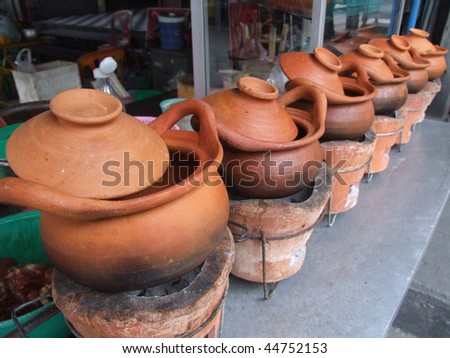 Clay pots for cooking outside a restaurant in Bangkok, Thailand.