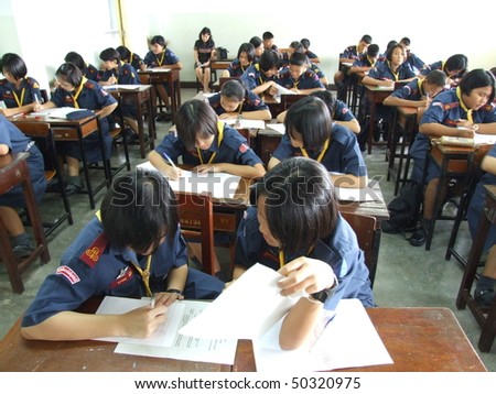 SEEKAN SCHOOL, BANGKOK, THAILAND- MAY 11: Students sit in the classroom learning English. Seekan School, Don Muang in May 11 2005 in Bangkok.