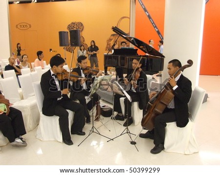 BANGKOK, THAILAND - JANUARY 8: Thai musicians play classical music at the Siam Paragon shopping center at the grand opening. January 8 2005, Siam center, Bangkok.
