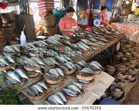 BANGKOK, THAILAND - JANUARY 20 : Women sell fish at fish market January 20, 2006 in Bangkok.