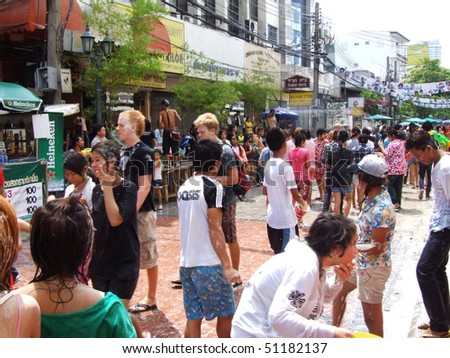 BANGKOK, THAILAND - APRIL 13: People throw water to celebrate the Songkran new year festival on April 13, 2007 in Bangkok, Thailand. The water is thrown because April is Thai summer and 40 degrees Celsius.