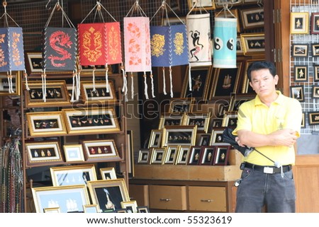 PATTAYA, THAILAND - AUGUST 28: Thai man sells Buddhist ornaments to tourists on August 28, 2009 in Pattaya.