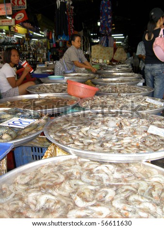 stock photo : PATTAYA, THAILAND - JUNE 2: Thai woman sells seafood on June