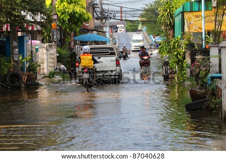 PRATHUMTHANI, THAILAND - OCTOBER 19: Heavy flooding from monsoon rain in Ayutthaya and north Thailand arriving in Bangkok suburbs on October 19, 2011 in Prathumthani, Thailand.
