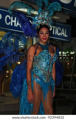 KOH SAMUI, THAILAND - SEPTEMBER 14: Transvestites stand at night in Haad Chewang nightclub area advertising the Miss Tiffany drag queen show in Chewang on September 14, 2011 in Koh Samui.