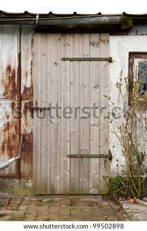 Old door and old and dirty house