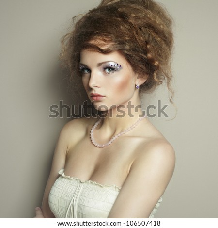 Portrait of beautiful  woman with elegant hairstyle. Fashion photo