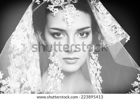 Fashion photo of beautiful women under white veil. Beauty portrait. Black and white