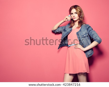 Fashion portrait of beautiful young woman in a summer dress. Beauty spring photo