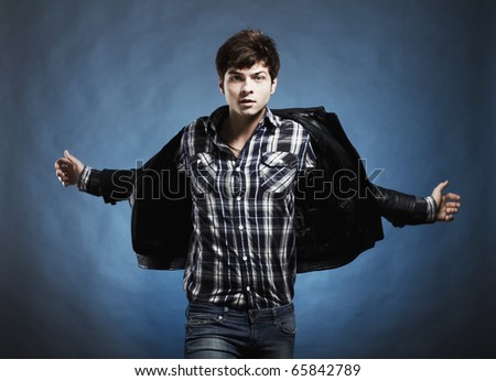Portrait of the young beautiful man in a jump