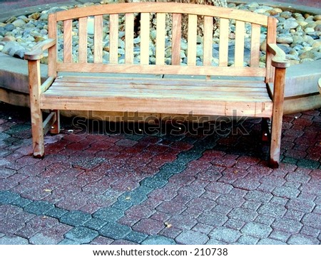 image of outdoor wooden bench, taken in an outdoor mall courtyard