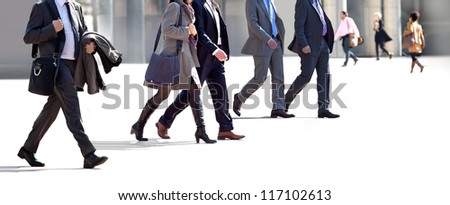 Employees going against the office. Panorama. A group of businessmen.