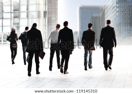 Employees going against the office. Panorama. A group of businessmen.
