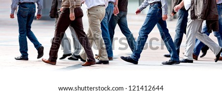 Group employees going against the office. Panorama. A group of businessmen.
