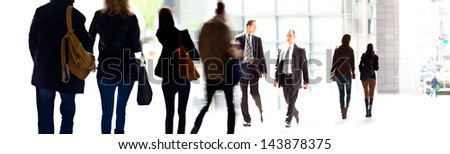 A large group of people on a light background. Panorama. Urban scene.