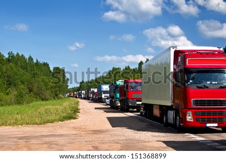 Traffic jam congestion. Trucks in a row.