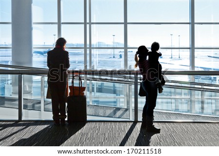 Passengers at the airport. Woman and child.