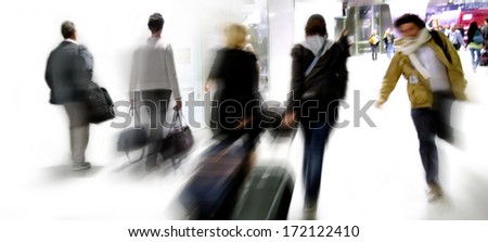 Group of business people walking. Arriving passengers. Blurred motion.