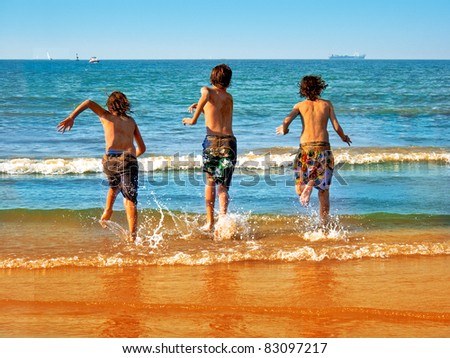 Gentle waves splash onto a golden shore. The streaming boys.